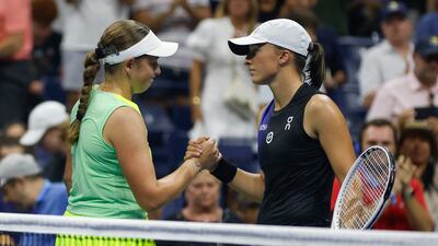 Jelena Ostapenko and Iga Swiatek shake hands at the end of their match in the US Open fourth round. Getty