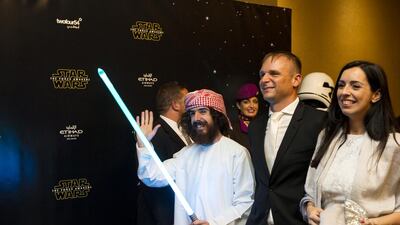 Benjamin Bernard from USA arrives wearing national dress and holding a light saber ahead of the Star Wars: The Force Awakens, Middle East premiere at Emirates Palace in Abu Dhabi. Christopher Pike / The National