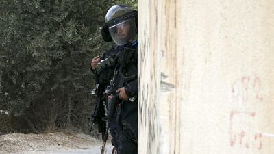 Israeli forces stand guard in the village of Shuwaykah where the man who shot dead two Israelis earlier used to live, in the occupied West Bank. AFP