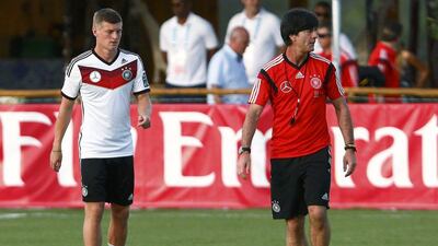 Germany coach Joachim Loew walks beside player Toni Kroos during a training session on Thursday at the 2014 World Cup in Brazil. Arnd Wiegmann / Reuters / June 18, 2014
