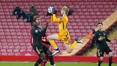 Liverpool goalkeeper Caoimhin Kelleher claims a catch. EPA