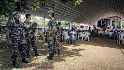 Security officers at a tent prepared for victim memorials at St Sebastian’s Church in Negombo, Sri Lanka, April 23, 2019. Jack Moore / The National.