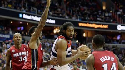 Washington Wizards' Nenà goes to the basket against Miami Heat.