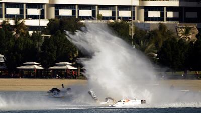 Thani Al Qamzi of UAE and Ahmed Al Hameli of the Abu Dhabi F1 team crash at the UIM F1 H2O powerboat Grand Prix of Abu Dhabi -November 28-29, 2013. Picture by Paul Lakatos.