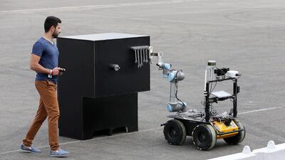 A member of the Mohammed Bin Rashid Space Centre team takes part in the Mohammed Bin Zayed International Robotics Challenge at Yas Marina Circuit in Abu Dhabi on Thursday. Pawan Singh / The National