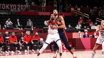 Kevin Durant and Rudy Gobert of France fight for position.
