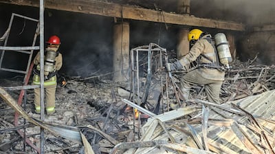 Firefighters tackle a blaze at the site of an Israeli air strike in Beirut’s southern suburbs. AFP