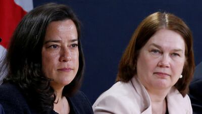 Canada's former justice minister Jody Wilson-Raybould sits to the left of Jane Philpott at a news conference in Ottawa. Reuters