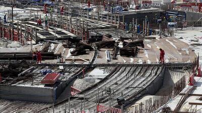 Above, construction activity in one of the football venues for the 2022 Fifa World Cup in Qatar. Lars Baron / Bongarts / Getty Images