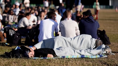 Spectators in the queue on day ten of Wimbledon, at the All England Lawn Tennis and Croquet Club, London. PA