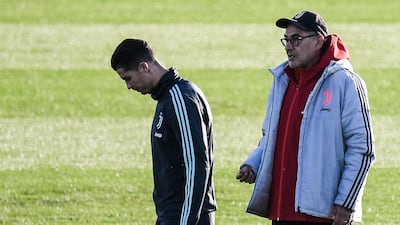 Juventus' coach Maurizio Sarri (L) talks to Portuguese forward Cristiano Ronaldo during a training session at the Continassa Training Ground in Turin. AFP