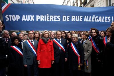 Clichy la Garenne's mayor Remi Muzueau led a demonstration against Muslim street prayers, in the Paris suburb of Clichy la Garenne on Friday November 10. Thibault Camus/ AP Photo