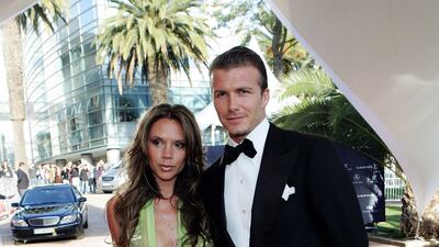 David, in a classic tux, and Victoria Beckham arrive at the Laureus World Sports Awards at the Estoril Casino in Portugal on May 16, 2005. Getty Images