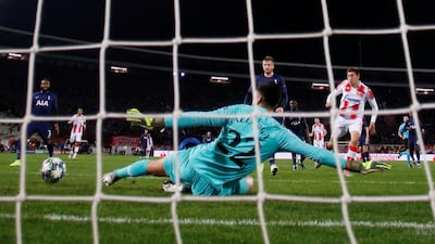 Tottenham Hotspur goalkeeper Paulo Gazzaniga saves from Red Star Belgrade's Milan Pavkov. Reuters