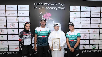 UAE cyclist Safia Al Sayegh, left, Secretary General of Dubai Sports Council Saeed Mohammed Hareb, right, and members of the Dubai Police amateur cycling team at the press conference for the Dubai Women's Tour. Courtesy Dubai Women's Tour