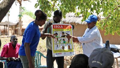In this Tuesday Feb. 26 2019 photo, health workers give a training presentation about how to detect and prevent the spread of Ebola, in an army barracks outside South Sudan's town of Yei. AP