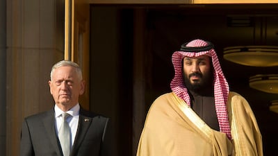 Defense Secretary Jim Mattis, left, and Saudi Crown Prince Mohammed bin Salman stand for the playing of the Saudi Arabia national anthem as Mattis welcomes the Crown Prince to the Pentagon in Washington, Thursday, March 22, 2018. (AP Photo/Cliff Owen)