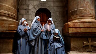 Nuns take part in the Catholic Washing of the Feet ceremony on Easter Holy Week in the Church of the Holy Sepulchre in Jerusalem's Old City, April 14, 2022. REUTERS / Ammar Awad