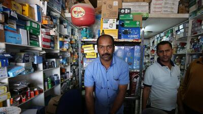 Rasheej Babu, left, at an electrical hardware shop in Umm Al Quwain’s Al Riqa area. Pawan Singh / The National