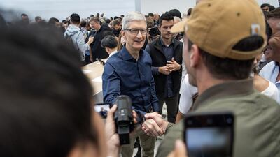 Tim Cook mingles with attendees. David Paul Morris / Bloomberg