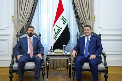 Iraq's incoming Prime Minister Ali Al Zaidi, left, with incumbent Mohammed Shia Al Sudani. AFP