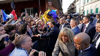 The French President and his wife were met by a sea of well-wishers. AP