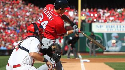 Washington Nationals' Kurt Suzuki hits a single against St Louis Cardinals during their playoff at Busch Stadium