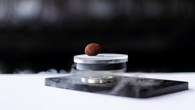 ‘The Floating Chocolate’: a chocolate truffle that floats in mid-air using magnets and nitrogen for a levitating show, on the menu at Masala Library. (Photo: Reem Mohammed/The National)