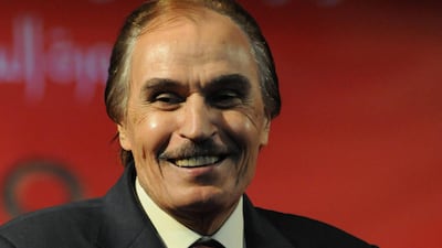 Egyptian actor Ezzat Al Alaili smiles as he holds his lifetime achievement award after being honoured at the 60th Catholic Centre Film Festival in Cairo on May 25, 2012. AFP