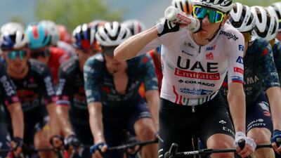 UAE Team Emirates' Tadej Pogacar takes on water. Reuters