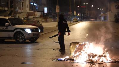 Tunisian security forces clash with protesters. Fethi Belaid / AFP Photo
