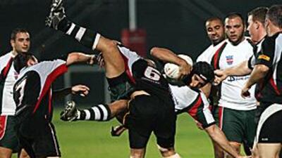 The UAE Falcons' Billy Asmar puts in a crunching tackle on Liban Espoir's Hani Rifai during the Falcon's 34-10 win at The Sevens.