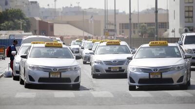 Taxis waiting for passengers in Abu Dhabi. Ravindranath K / The National