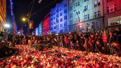 People are seen by candles during a reenactment of the 1989 protest march to commemorate the 30th anniversary of the 1989 Velvet Revolution in Prague. Getty