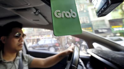 Backed by the likes of China's Didi Chuxing and Japan's MUFG, Singapore-based Grab is aiming to transform its business. REUTERS/Kham