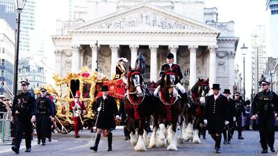 Mr Mainelli rides through the City in the State Coach. PA