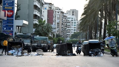 Anti-government protesters block a main road in Beirut. EPA