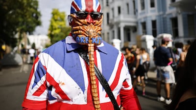 A person wears a Union Flag outfit and a mask with 'Brexit' painted on it during a carnival in London last month. EPA