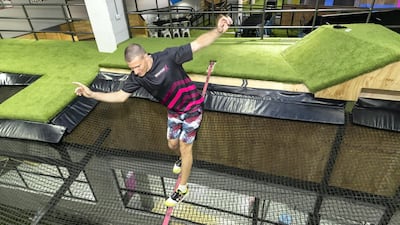 Bounce X venue manager Petar Popovic demonstrates walking across a tightrope. Antonie Robertson / The National