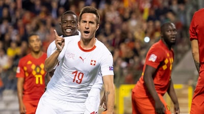 Switzerland's Mario Gavranovic celebrates making it 1-1 against Belgium. EPA
