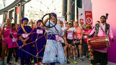 A dhol group performs before the 5km run at the Dubai Women's Run.