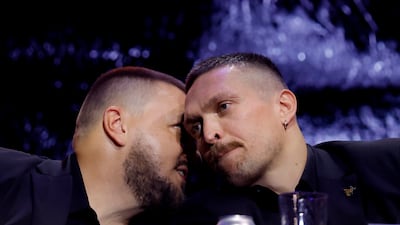 Oleksandr Usyk and promoter Alex Krassyuk during the press conference. Reuters