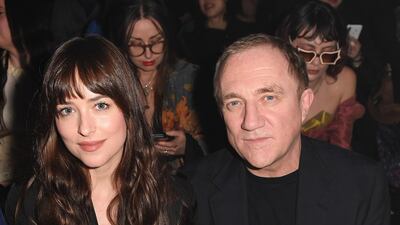 Dakota Johnson and Francois-Henri Pinault are seen on the Gucci front row during Milan Fashion Week on February 19, 2020. Getty Images