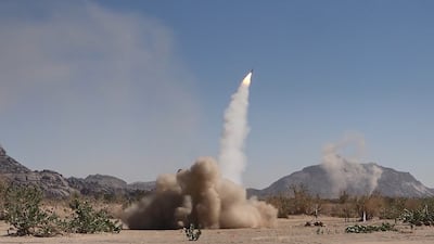 Yemen's Houthi rebels launch a rocket during a military exercise in the northern province of Saada near the border with Saudi Arabia. EPA