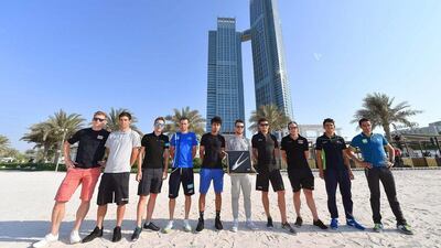 The lead riders for each Abu Dhabi Tour team pose for photos during the riders' presentation. Luca Zennaro / EPA