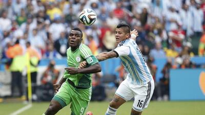 Emmanuel Emenike, left, in action for Nigeria at the 2014 Fifa World Cup. Edgard Garrido / Reuters