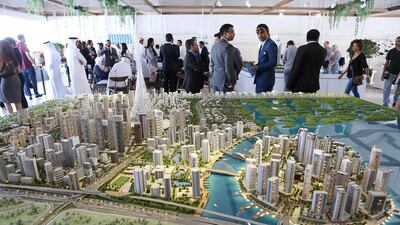 Above, visitors view a scaled version of the Dubai Creek development. Pawan Singh / The National