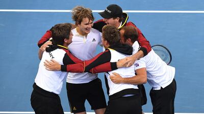Alexander Zverev, second left, celebrates with the Germany team after his win over Nick Kyrgios. Dave Hunt / EPA