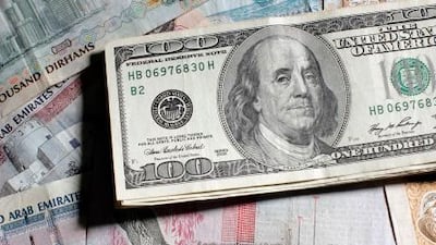 ABU DHABI, UNITED ARAB EMIRATES - June 21, 2008: United States of America dollars with United Arab Emirates dirhams shot in studio. ( Ryan Carter / The National ) *** stock, money, US dollars, dollar, United States of America, Dirhams, Dirham, UAE, *** Local Caption *** RC044-MoneyUSA.JPGRC044-MoneyUSA.JPGRC044-MoneyUSA.JPG