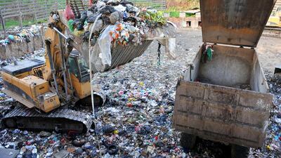 A backhoe deposits a load of garbage into a truck at the Malagrotta landfill outside of Rome. The Malagrotta landfill, Europe's largest, was closed lin 2013 after European Union authorities ruled it unfit to treat waste. Chris Warde-Jones / Bloomberg News